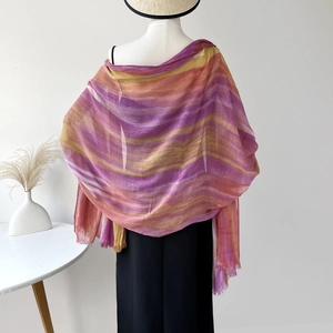 Close-up of lightweight gradient rayon shawl with vibrant purple to orange tie-dye colors
