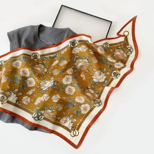 Detail of vintage French silk scarf with oil painting floral pattern and herringbone weave