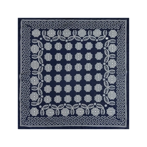 Detail of navy blue square headscarf with white bohemian floral patterns and fine stitching