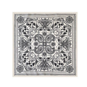Detailed close-up of ivory square scarf featuring black paisley and cashew flower patterns