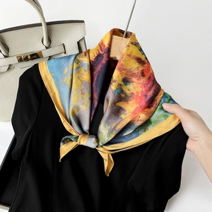 Detailed shot of floral oil painting silk scarf tied on neck with vibrant satin finish