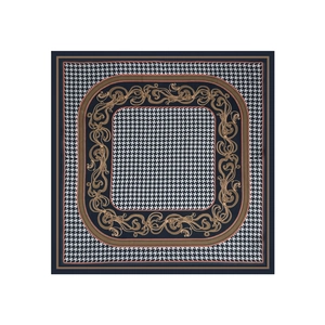 Detailed view of square silk scarf with houndstooth and baroque scroll pattern