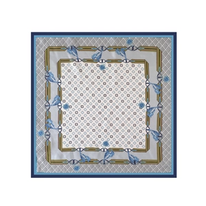 Detail of elegant satin square scarf featuring clover floral prints and buckle patterns