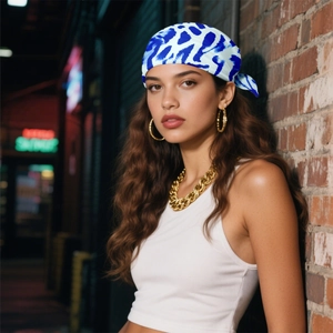 Fashionable blue and white leopard print silk scarf styled as a trendy headwrap