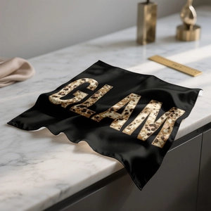 Fashionable leopard GLAM print square silk scarf on a white marble background surface
