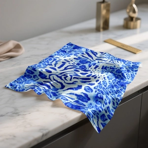 Blue and white leopard print square silk scarf with a vibrant animal pattern and glossy finish