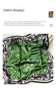 Detailed view of green paisley faux silk scarf fabric texture and floral pattern