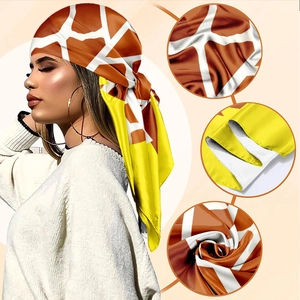 Silk fashion scarf with orange giraffe print and yellow borders for stylish women