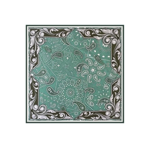 Detailed pattern of mint green paisley square silk scarf with olive scrollwork border