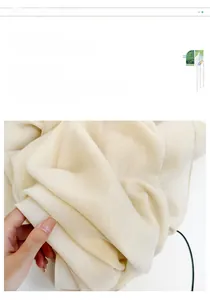 Detail showing the soft drape and silky texture of this off-white solid color chiffon scarf