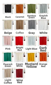 Collection of lightweight scarves in 18 assorted solid colors displayed on wooden hangers