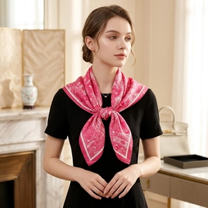 Elegant rose pink paisley satin silk scarf tied in a bow on a model with black dress