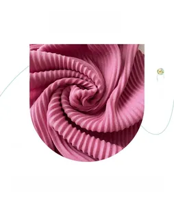 Detail shot of pleated rose red fabric showing texture and soft draping of the scarf