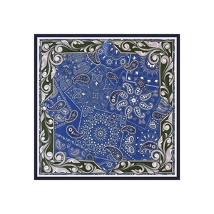 Detailed view of paisley silk-like square scarf with intricate blue and green patterns