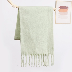 Soft mint green mohair scarf for women with elegant long fringe and fluffy texture