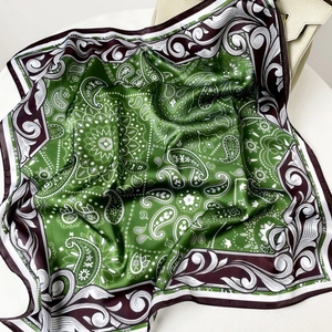 Green and white paisley silk scarf with baroque floral border on elegant white background