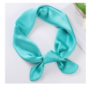 Detailed view of smooth teal satin silk scarf tied in a bow with elegant glossy finish