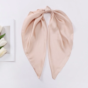 Pink satin silk square scarf with elegant knot and white tulip on clean background
