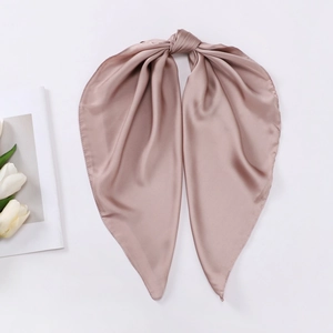 Detailed view of knotted satin silk square scarf in elegant dusty pink with smooth finish