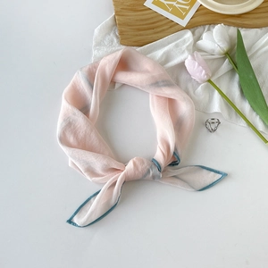 Elegant light pink square silk scarf with blue striped edges and minimalist floral decor