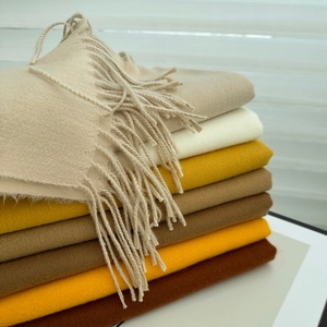 Soft faux cashmere scarves in solid colors with fringe edges for winter warmth