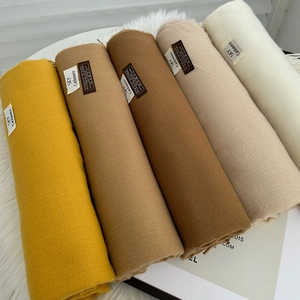 Set of 100% virgin wool scarves in autumn colors like yellow, brown, and cream