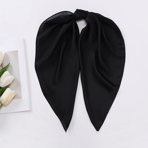 Close-up of black satin silk scarf with elegant glossy finish and smooth texture