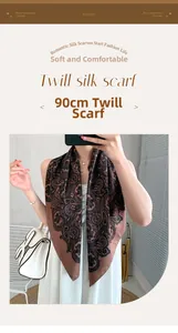 Detail of 90cm paisley twill silk scarf showing soft texture and brown floral pattern