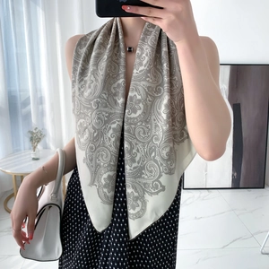 Elegant paisley floral satin scarf in beige-grey shown on a model for daily wear