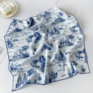 Detail of cotton square scarf featuring blue Toile de Jouy patterns and fine stitched edges