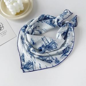 Detail of blue Toile de Jouy floral print on a premium cotton square scarf fabric