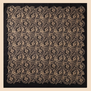 Close-up of elegant black and gold paisley patterns on twill silk square scarf