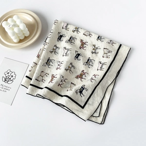 Beige cotton silk scarf featuring abstract horse prints with black border decoration