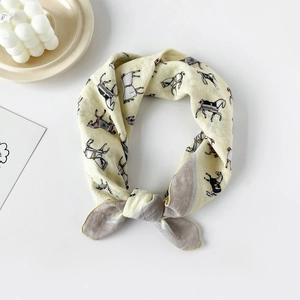 Detail of cotton square scarf featuring classic horse print and knotted styling