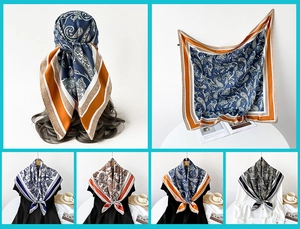 Detailed view of four elegant paisley printed square scarves in various color palettes