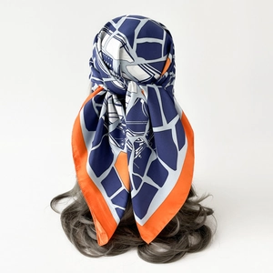 Detailed shot of lightweight twill silk scarf tied as a headscarf on a model