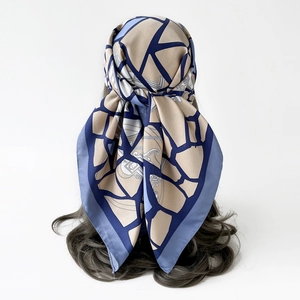 Elegant geometric patterned large silk square scarf in blue and beige color tones