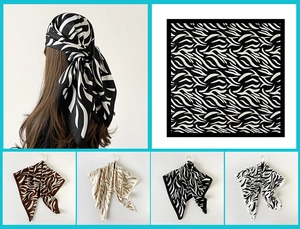 Detailed close-up showing abstract zebra patterns on high-quality satin silk square scarves