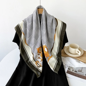 Detailed texture of silk scarf with houndstooth and yellow floral patterns on a dress