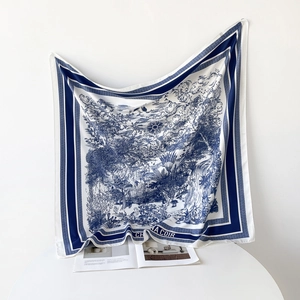 Detail of luxury square silk scarf with blue French Toile de Jouy artistic scenery print