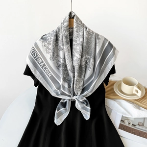 Detailed view of 90cm twill silk scarf featuring grey Toile de Jouy landscape print