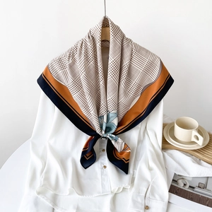 Elegant houndstooth and floral silk square scarf in orange and navy blue on white shirt
