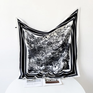 Detail of 90cm silk scarf featuring black and white ink forest patterns and stripe border