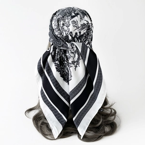 Macro detail of Toile de Jouy silk scarf with black stripes on head mannequin