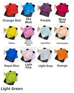 Selection of thirteen colorful satin square scarves presented in black gift boxes