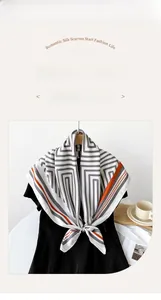 Detailed close-up of 90cm twill silk scarf with orange borders on a black mannequin