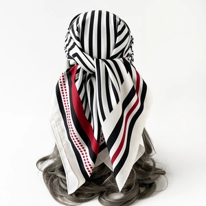 Detail view of 90cm striped silk scarf styled as a headband on a mannequin head