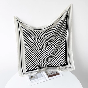 Detail of 90cm striped square silk scarf with black and white geometric spiral pattern