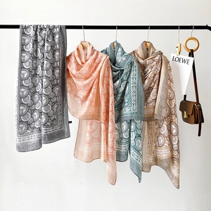 Detailed display of four cotton linen scarves with vintage geometric shell patterns
