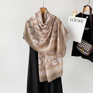 Detail shot of lightweight cotton linen scarf with geometric conch shell patterns
